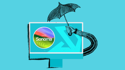 Umbrella over a computer screen with macos sonoma on it.