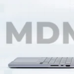 Composition with two Macbooks and MDM legacy in the back.