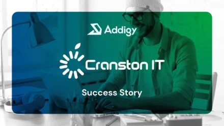 Addigy and Cranston IT Success Story graphic, featuring both logos over a blue-to-green tinted image of a smiling person wearing a beanie working on a laptop at a desk.