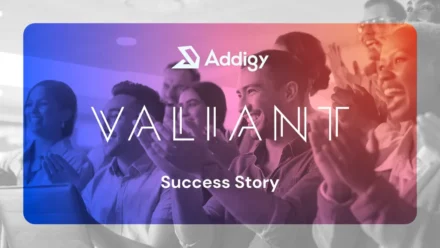 Addigy and Valiant Success Story graphic, featuring both logos over a blue-to-orange tinted image of a diverse group of people applauding at an event.