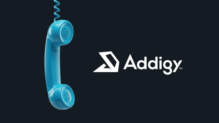 An old phone tube hanging beside an Addigy logo