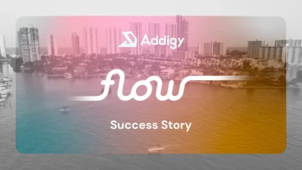 The Flow logo in white script overlaid on an aerial view of a Miami waterway with city buildings in the background, tinted with a pink-to-golden gradient.