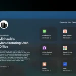 Addigy Assist in Apple MDM during macOS enrollment: End-user welcome screen for Michaela at Smith's Manufacturing with Prebuilt Apps like Numbers 14, Firefox, Google Chrome, Zoom, and Canvas installing in real-time for zero-touch device onboarding.