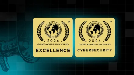 Two gold Globee Awards badges for 2026, each featuring a globe surrounded by laurel wreaths. The left badge reads 'Globee Awards Gold Winner – Excellence' and the right reads 'Globee Awards Gold Winner – Cybersecurity.' Both are displayed against a dark background with a faint key graphic.