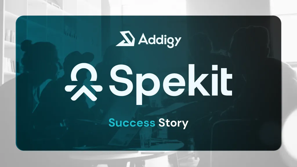 Addigy and Spekit Success Story feature image. A dark teal-tinted photo of people in a meeting sits inside a rounded card, with the Addigy logo at top, the Spekit logo prominently in the center, and 'Success Story' in teal and white at the bottom.