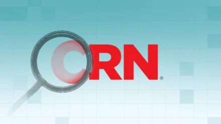 CRN logo with an illustration of a magnifier for Addigy Press Coverage.
